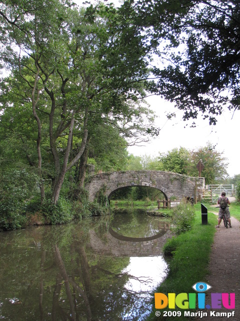 SX09625 Jenni and reflections of bridge 75 on Monmouthshire and Brecon Canal